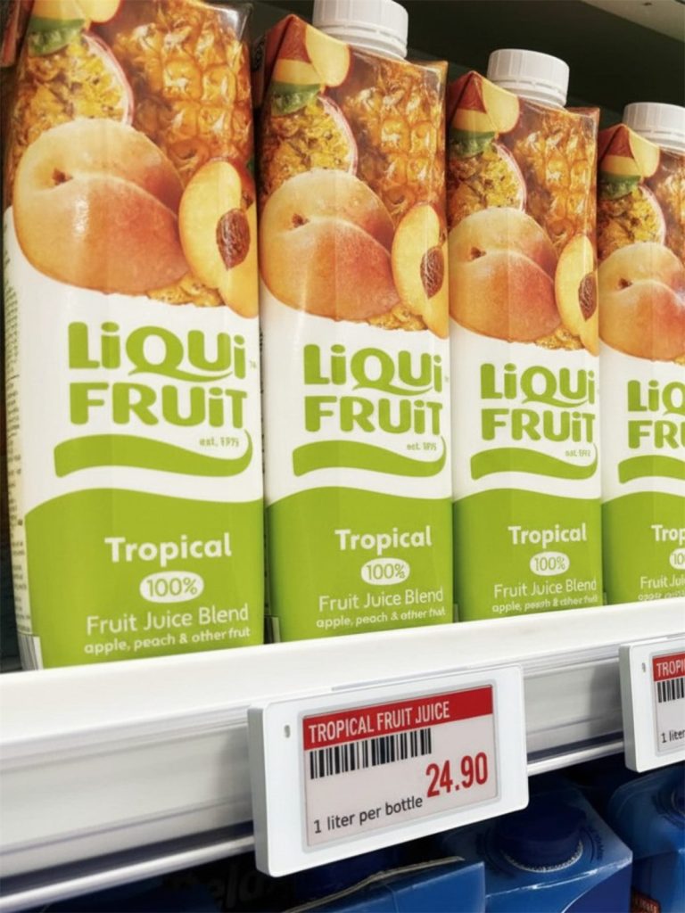 Electronic shelf labels South Africa: red and white e-paper price label on a supermarket juice shelf